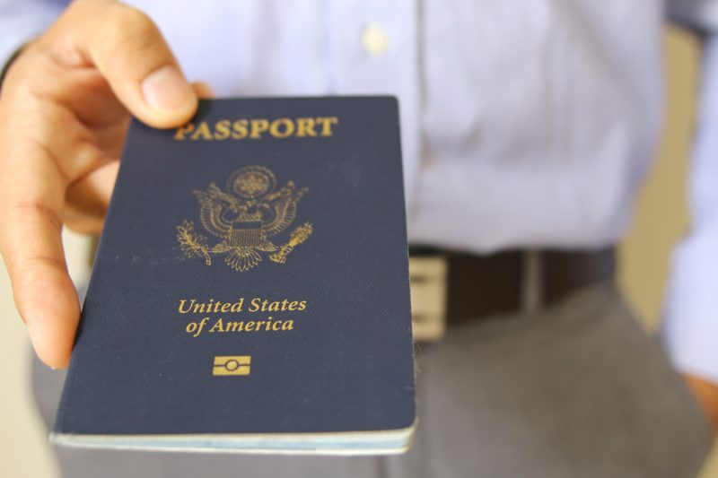 Hand Holding an American Passport