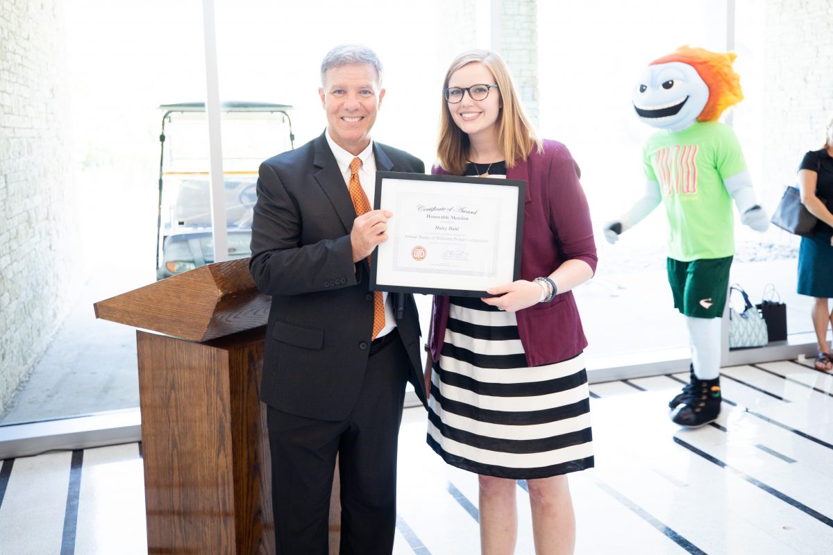Haley Dahl, a molecular and cell biology PhD candidate in biological sciences, is commended for her accomplishment with the Vice President for Research.